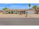 Charming single-story home with desert landscaping, a covered porch, and an attached two-car garage at 301 N 87Th St, Mesa, AZ 85207