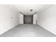 Clean, empty garage with ample space for vehicle parking or storage at 301 N 87Th St, Mesa, AZ 85207