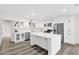 Bright modern kitchen with white cabinets, stainless steel appliances, and a large center island at 301 N 87Th St, Mesa, AZ 85207