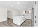 Spacious kitchen featuring an island with ample storage, stainless appliances, and neutral tones at 301 N 87Th St, Mesa, AZ 85207
