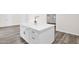 Modern kitchen island featuring white countertops, sleek hardware, and updated flooring at 301 N 87Th St, Mesa, AZ 85207