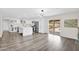 Open-concept kitchen with stainless steel appliances and an island, connecting to the living space and outdoor pool at 301 N 87Th St, Mesa, AZ 85207