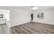 Bright and open-concept living area featuring modern flooring and a decorative accent wall at 301 N 87Th St, Mesa, AZ 85207