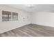 Clean and modern living room with neutral walls, wood-style floors, and a bright window at 301 N 87Th St, Mesa, AZ 85207
