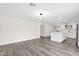 Bright living space features modern pendant lighting and seamless flow into the kitchen at 301 N 87Th St, Mesa, AZ 85207