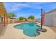 Inviting pool area featuring a diving board, lush greenery, and ample space for lounging and enjoying sunny days at 301 N 87Th St, Mesa, AZ 85207