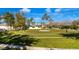 Manicured common area features lush landscaping and seating at 3301 S Goldfield Rd # 1046, Apache Junction, AZ 85119