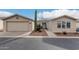 Inviting single-story home featuring low maintenance landscaping and an attached two-car garage at 3301 S Goldfield Rd # 1046, Apache Junction, AZ 85119