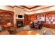 Community library with fireplace, built-in shelving, and cozy seating areas for reading and relaxation at 3301 S Goldfield Rd # 1046, Apache Junction, AZ 85119