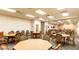 Spacious meeting room is complete with tables and chairs in this clubhouse at 3301 S Goldfield Rd # 1046, Apache Junction, AZ 85119