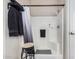 Walk-in shower with a built-in bench, white tile surround, and modern fixtures with a stool nearby at 3301 S Goldfield Rd # 1046, Apache Junction, AZ 85119