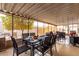 Bright sunroom with dining table set for a meal and views of the beautifully landscaped yard at 3301 S Goldfield Rd # 1046, Apache Junction, AZ 85119