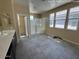 Large primary bathroom with tile floor, dual sinks, and glass walk-in shower at 359 N 157Th Ln, Goodyear, AZ 85338