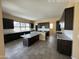 Spacious kitchen featuring two islands with granite countertops, gray cabinets and tile flooring at 359 N 157Th Ln, Goodyear, AZ 85338