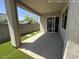 View of a covered patio with artificial grass and concrete at 359 N 157Th Ln, Goodyear, AZ 85338