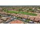 An aerial view showcases this home's proximity to the golf course and a well-maintained neighborhood at 3702 N 160Th Ave, Goodyear, AZ 85395