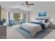 Cozy primary bedroom featuring a bay window for ample natural light and a stylish color palette at 3702 N 160Th Ave, Goodyear, AZ 85395