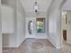 Welcoming foyer features decorative tile flooring, a front door with an oval window, and a charming interior view at 3702 N 160Th Ave, Goodyear, AZ 85395