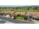 Beautiful single-Gathering home with lush landscaping, desert accents, and a red tile roof overlooking the golf course at 3702 N 160Th Ave, Goodyear, AZ 85395