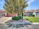 Beautiful home with mature landscaping, a well-maintained lawn, and a spacious driveway leading to a two-car garage at 3702 N 160Th Ave, Goodyear, AZ 85395