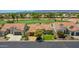 Charming single-story home with a well-manicured lawn, mature trees, and a welcoming curb appeal in a golf community at 3702 N 160Th Ave, Goodyear, AZ 85395