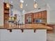 Open kitchen layout featuring a granite-topped island, stainless appliances, and ample cabinet storage at 3702 N 160Th Ave, Goodyear, AZ 85395