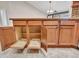 Kitchen cabinet features sliding shelves and interior, adjacent to granite countertops and sink at 3702 N 160Th Ave, Goodyear, AZ 85395