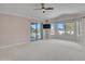 Bright living area with a sliding glass door, ample natural light and backyard access at 3702 N 160Th Ave, Goodyear, AZ 85395