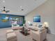 Inviting living room featuring comfortable seating, stylish decor, vaulted ceiling, and ample natural light at 3702 N 160Th Ave, Goodyear, AZ 85395