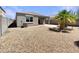 Spacious backyard featuring desert landscaping, a patio, and block wall fencing at 37711 W Bello Ln, Maricopa, AZ 85138