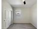 Bedroom with carpet, a window, a ceiling fan, and a closet with double doors at 37711 W Bello Ln, Maricopa, AZ 85138