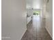 Open concept living/dining area with views to kitchen and outdoor patio at 37711 W Bello Ln, Maricopa, AZ 85138