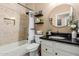 Cozy bathroom featuring a tub and shower combo with tiled walls and modern fixtures at 38560 N Joann Way, San Tan Valley, AZ 85140