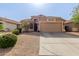 Inviting single-Gathering home with well-maintained lawn and desert landscaping, enhancing curb appeal at 38560 N Joann Way, San Tan Valley, AZ 85140