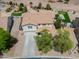 Aerial view of a home with a putting green, playground and landscaped backyard at 40232 W Marion May Ln, Maricopa, AZ 85138