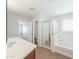 Bathroom features a soaking tub, shower, double sinks, and tile flooring at 40232 W Marion May Ln, Maricopa, AZ 85138