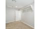 Neutral bedroom with closet and white door, freshly painted, with neutral carpet at 40232 W Marion May Ln, Maricopa, AZ 85138