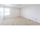 Bright bedroom with natural light, neutral walls, and ceiling fan at 40232 W Marion May Ln, Maricopa, AZ 85138