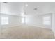 Large bonus room with neutral carpet, ceiling fan, and recessed lighting at 40232 W Marion May Ln, Maricopa, AZ 85138