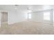 A huge bonus room boasts neutral carpet and plenty of bright, natural light at 40232 W Marion May Ln, Maricopa, AZ 85138