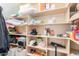 Organized closet with shelving and ample storage space for clothes and accessories at 40232 W Marion May Ln, Maricopa, AZ 85138
