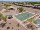 Community park featuring a basketball court, volleyball court, playground, and green space for leisure and recreation at 40232 W Marion May Ln, Maricopa, AZ 85138