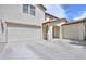 Beautiful home with a three-car garage and a spacious driveway for multiple vehicles at 40232 W Marion May Ln, Maricopa, AZ 85138