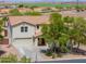Charming two-story home with a well-kept lawn and desert landscaping at 40232 W Marion May Ln, Maricopa, AZ 85138