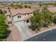 Well-maintained two-story home with a two-car garage and manicured landscaping at 40232 W Marion May Ln, Maricopa, AZ 85138