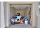 Cluttered garage filled with many stored items inside a home at 40232 W Marion May Ln, Maricopa, AZ 85138