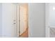 Hallway with white doors, neutral walls, and access to other rooms at 40232 W Marion May Ln, Maricopa, AZ 85138