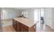 Open-concept kitchen with a large island, perfect for entertaining and adjacent to a cozy living area at 40232 W Marion May Ln, Maricopa, AZ 85138