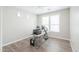 Bright office with hardwood floors, natural light, and a ceiling fan at 40232 W Marion May Ln, Maricopa, AZ 85138