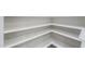 Shelves of a walk-in pantry for convenient storage and organization at 40232 W Marion May Ln, Maricopa, AZ 85138